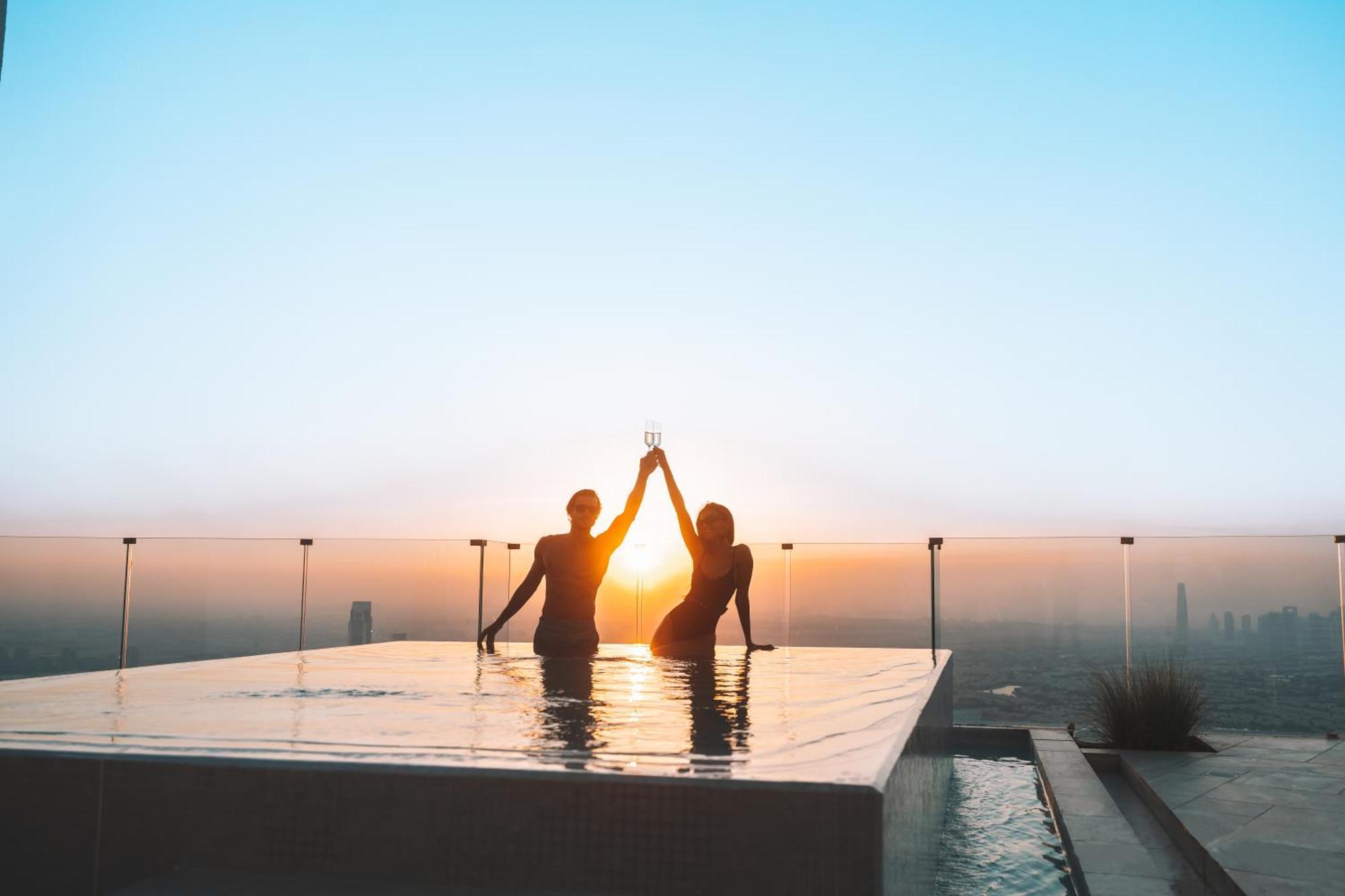 Five Jumeirah Village Dubai Esterno foto Sunset at the rooftop pool