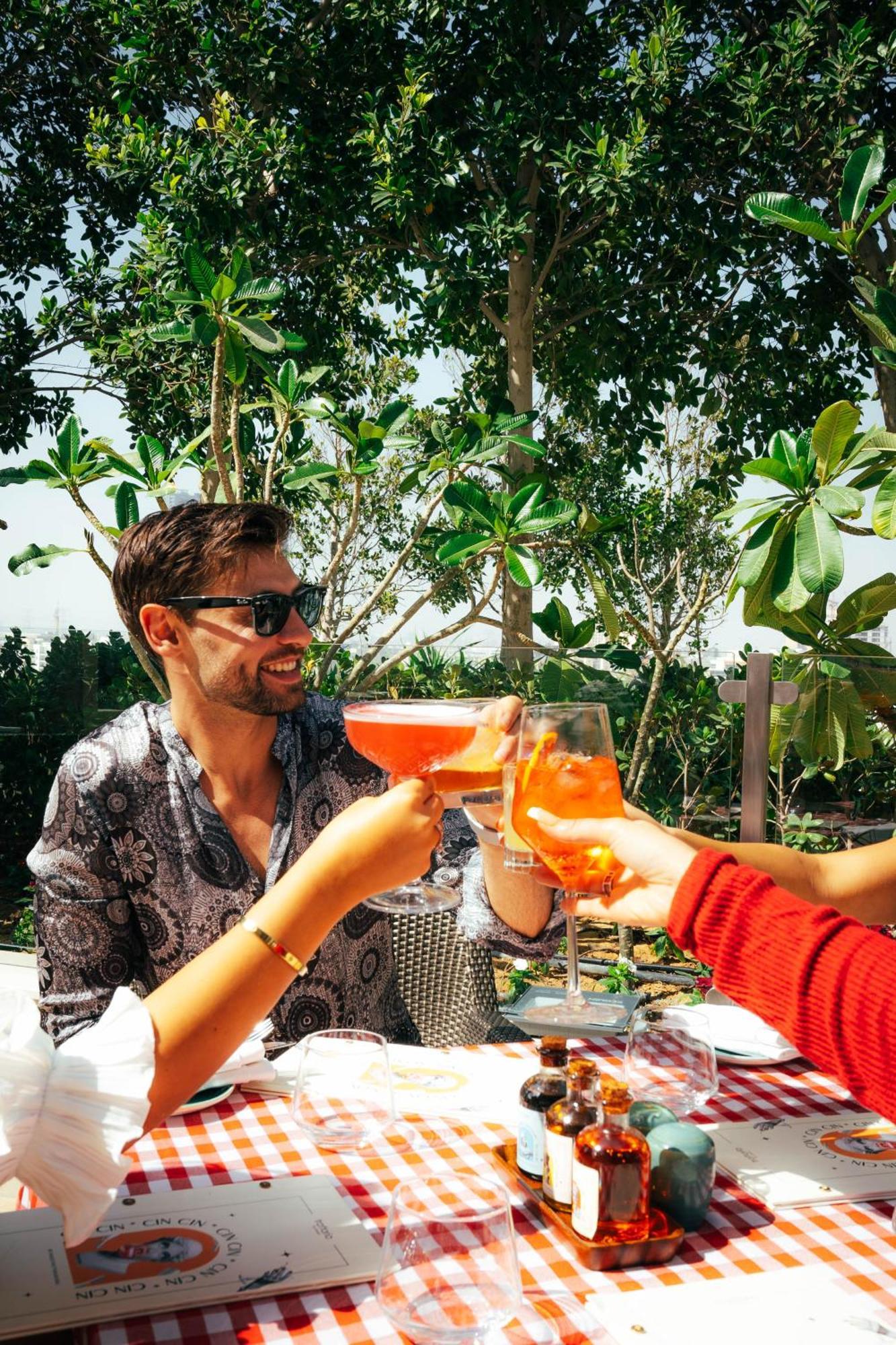 Five Jumeirah Village Dubai Esterno foto A man drinking a spritz